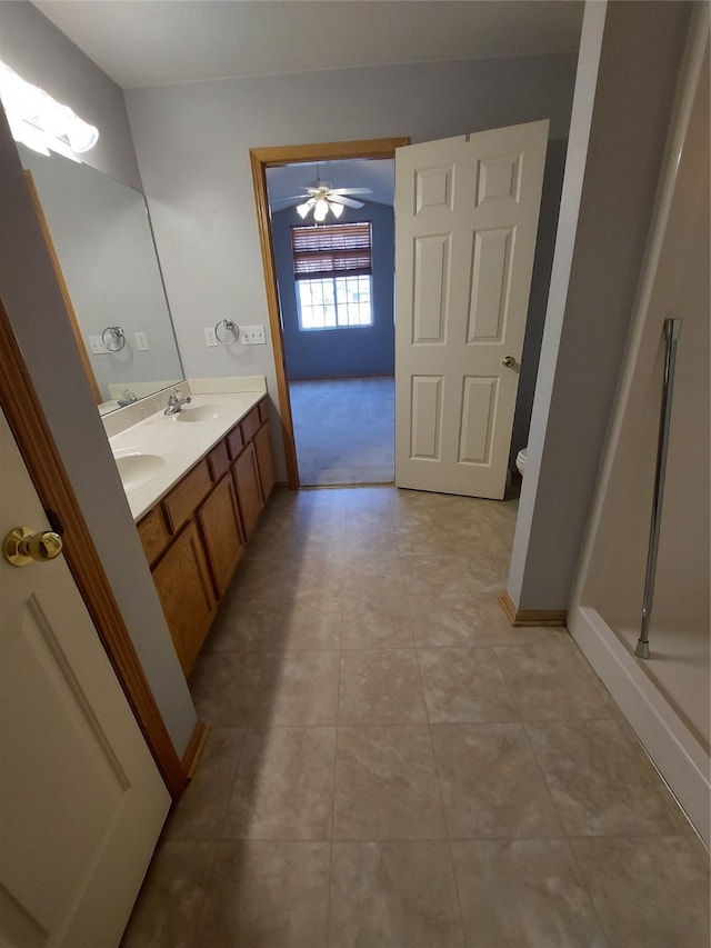 bathroom featuring ceiling fan, tile patterned flooring, vanity, and toilet