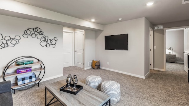 living room with carpet floors, recessed lighting, and baseboards