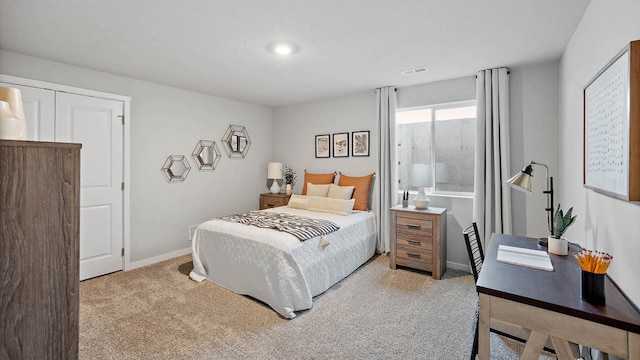 bedroom featuring light colored carpet