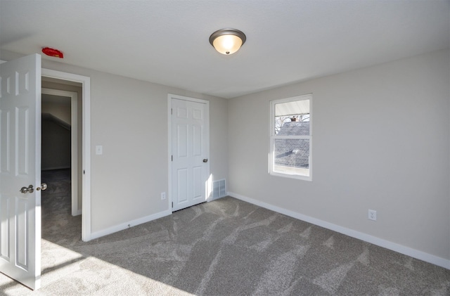 unfurnished bedroom with carpet flooring