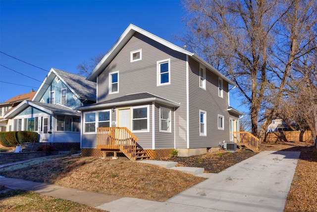 view of front property with central AC unit