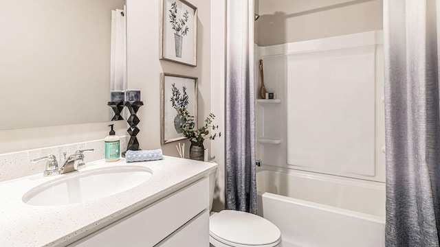 full bathroom featuring toilet, shower / bath combination with curtain, and vanity