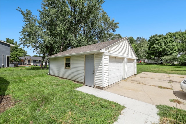 garage featuring a lawn