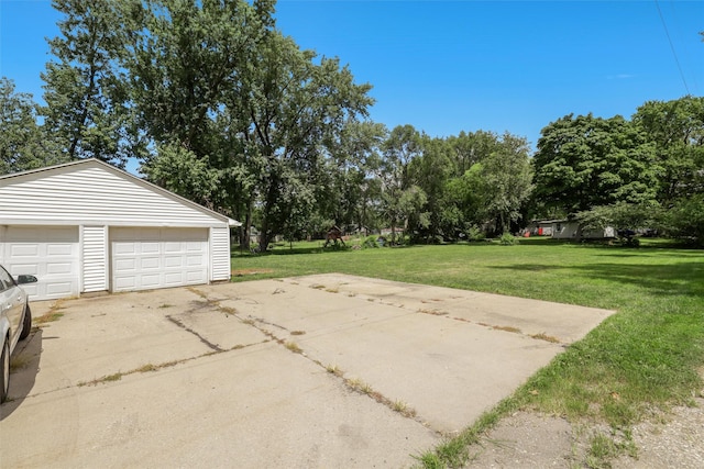 garage featuring a yard