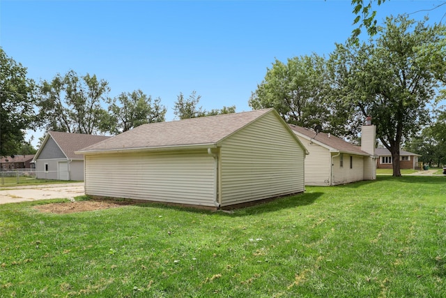 view of home's exterior with a yard