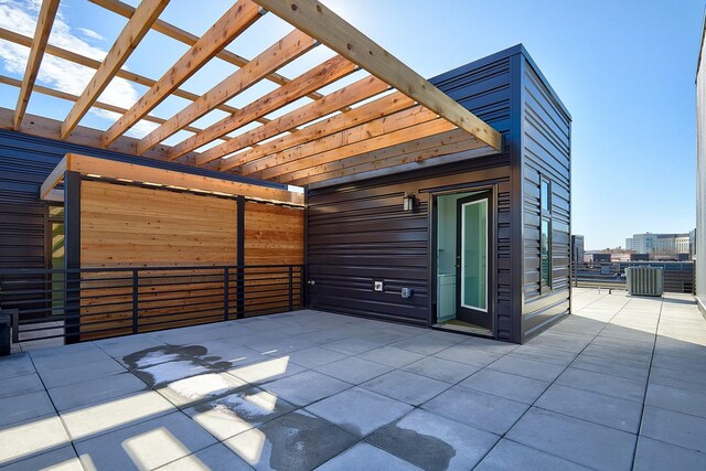 view of patio / terrace with a pergola and central air condition unit