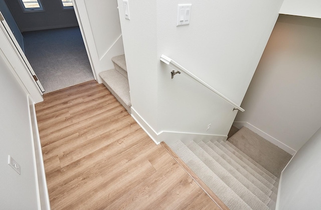 stairway featuring hardwood / wood-style floors