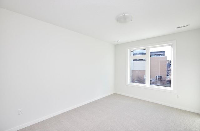 unfurnished room with carpet flooring