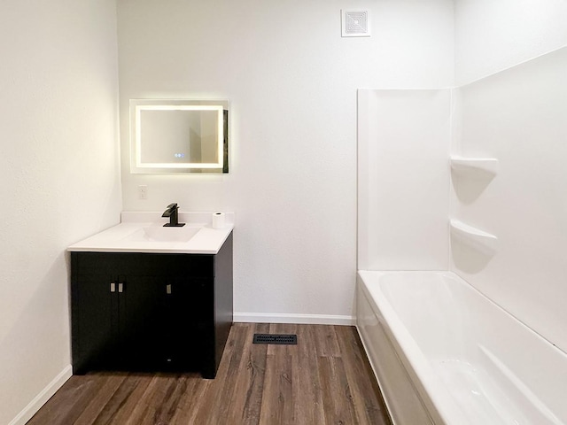 bathroom featuring vanity and wood-type flooring