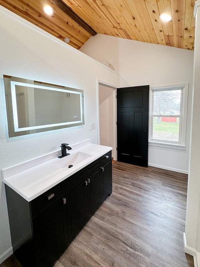 bathroom featuring hardwood / wood-style flooring, vanity, lofted ceiling, and wooden ceiling