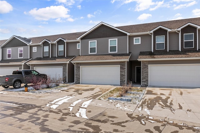 multi unit property featuring a garage