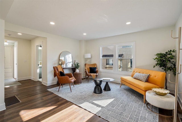 sitting room featuring dark wood-type flooring