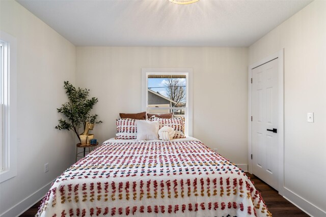 bedroom featuring dark wood-type flooring