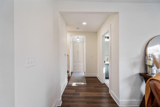 corridor featuring dark wood-type flooring