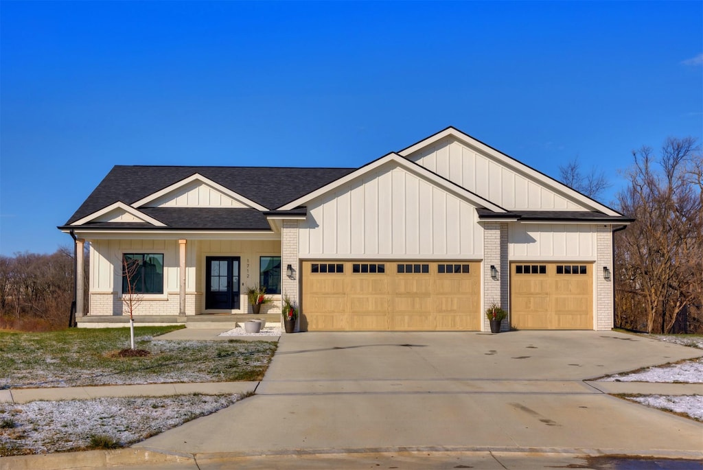 view of front of property featuring covered porch and a garage