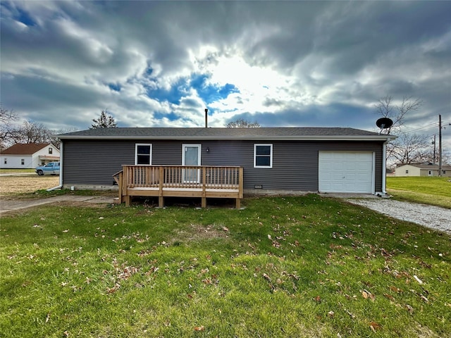 view of front facade with a front lawn, a garage, and a deck