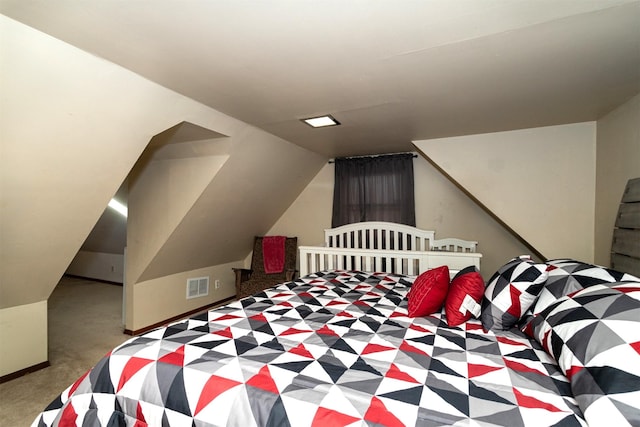 carpeted bedroom featuring vaulted ceiling