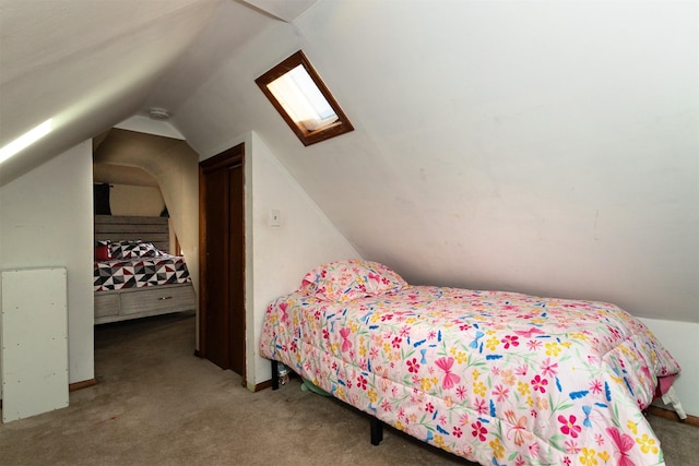 bedroom with carpet and lofted ceiling