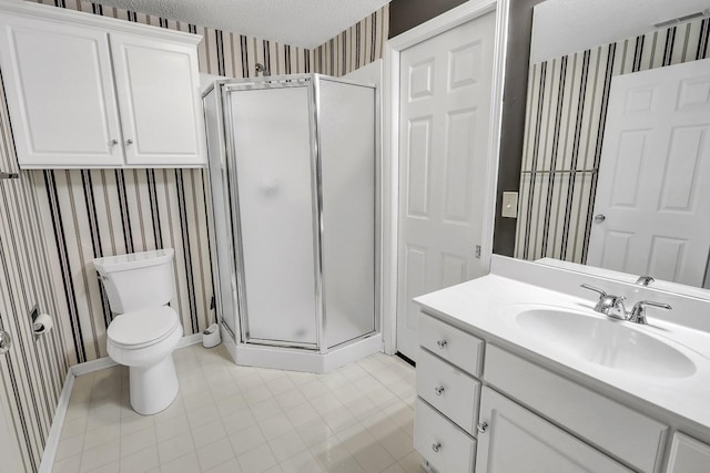 bathroom with vanity, a shower with door, tile patterned floors, toilet, and a textured ceiling