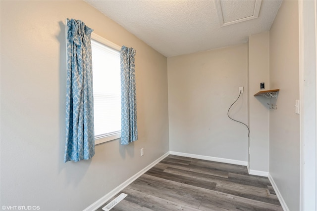 interior space with hardwood / wood-style floors and a textured ceiling