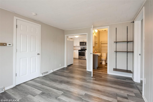 unfurnished living room featuring hardwood / wood-style floors