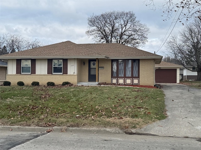 single story home with a garage and a front yard