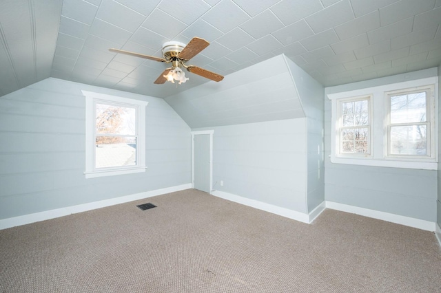 bonus room featuring carpet, vaulted ceiling, and ceiling fan