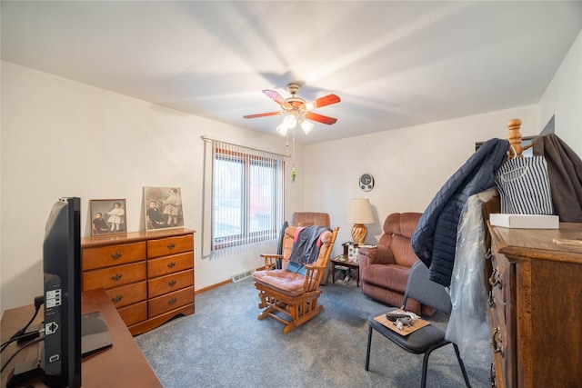 sitting room featuring ceiling fan and carpet floors