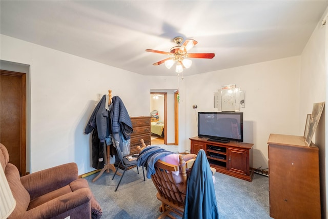 living room featuring light colored carpet and ceiling fan