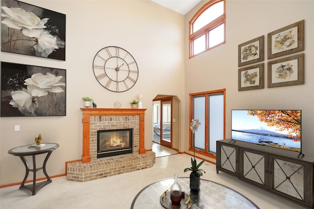 carpeted living room featuring a fireplace