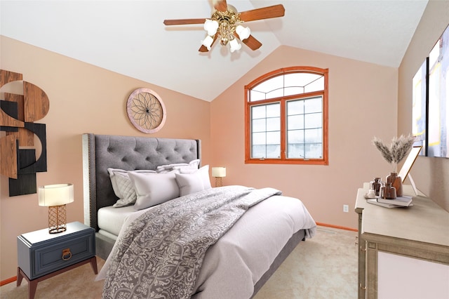 carpeted bedroom with ceiling fan and lofted ceiling