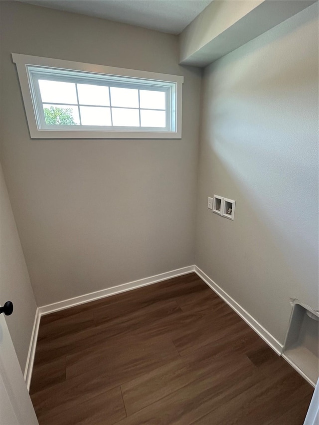 clothes washing area featuring dark hardwood / wood-style floors and washer hookup