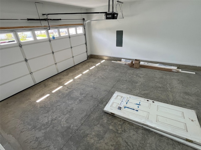 garage with a garage door opener and electric panel