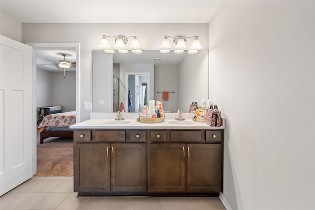 bathroom featuring tile patterned flooring, ceiling fan, walk in shower, and vanity