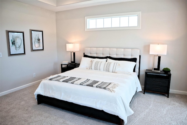 bedroom featuring light carpet