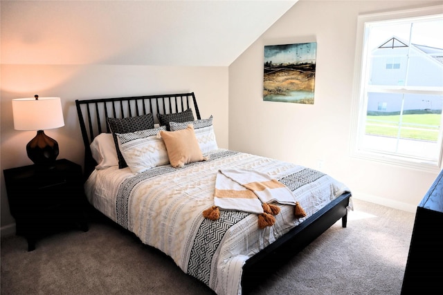 carpeted bedroom featuring lofted ceiling