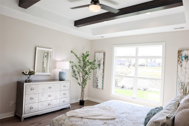 bedroom featuring beamed ceiling, ceiling fan, and dark hardwood / wood-style floors