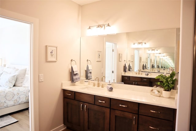 bathroom with hardwood / wood-style floors and vanity