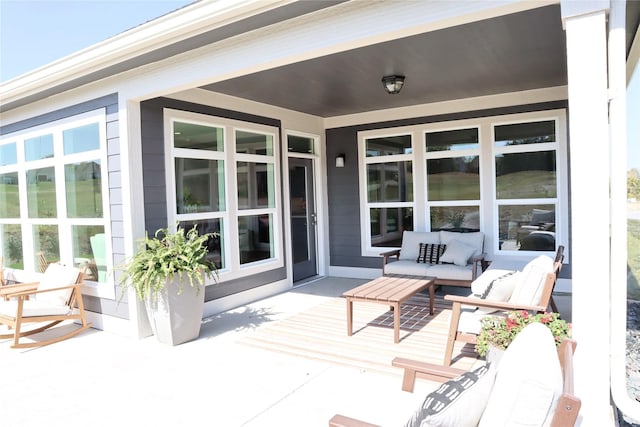 wooden terrace featuring an outdoor living space