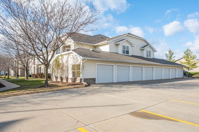 view of side of home featuring a garage