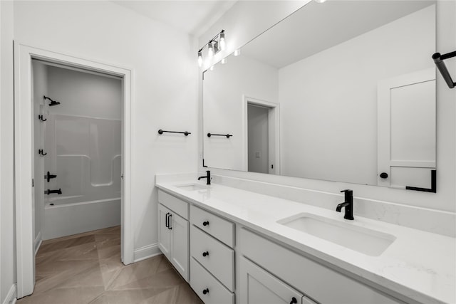 bathroom featuring vanity and washtub / shower combination