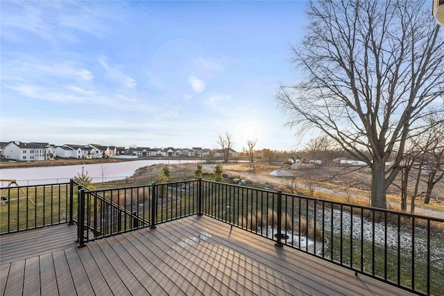 wooden terrace with a water view