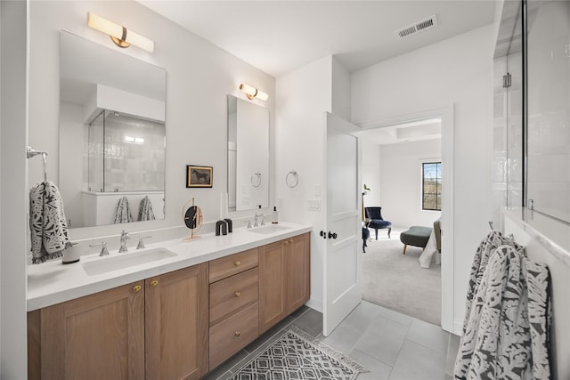 bathroom with vanity, tile patterned floors, and walk in shower