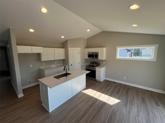 kitchen featuring stainless steel appliances, sink, a center island with sink, and white cabinets