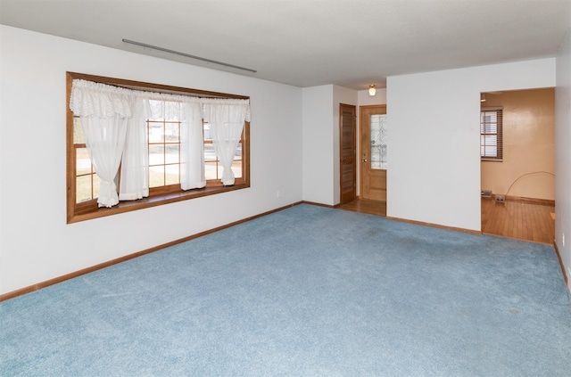 spare room with carpet