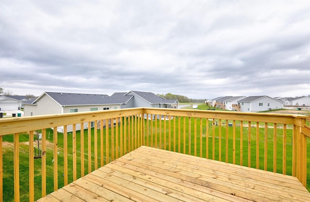 1064 NE 64th Ave, Des Moines, IA 50313 - wooden terrace featuring a lawn and a residential view