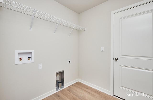 laundry area with washer hookup, hookup for an electric dryer, and light hardwood / wood-style floors