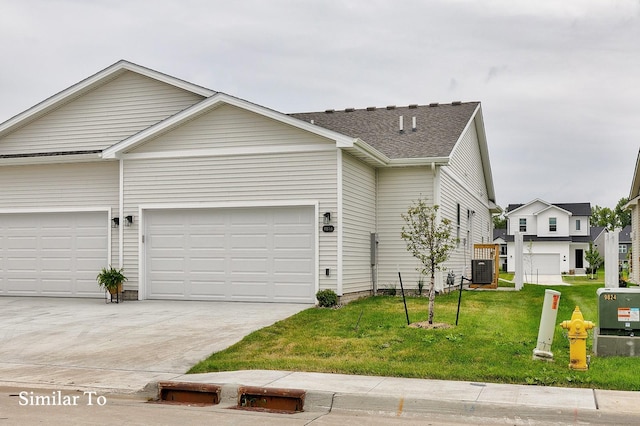 single story home with central air condition unit, a front yard, and a garage