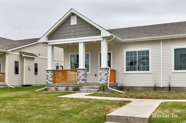 view of front facade featuring a front yard and a porch