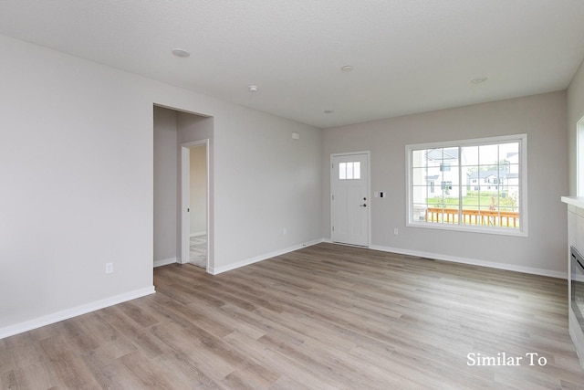 unfurnished room featuring light hardwood / wood-style floors